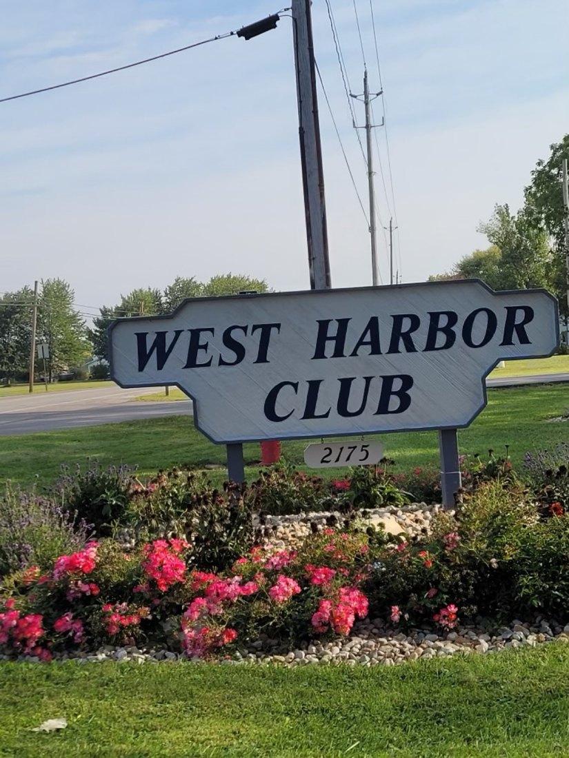 The West Harbor Club entrance sign at 2175 NE Catawba Road